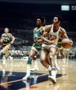 Walt Frazier: Knicks Icon Who Defined Basketball Cool
Walt Frazier is one of the most legendary figures in NBA history. Known for his elite defense, flashy style, smooth personality, and unforgettable performances with the New York Knicks, Frazier became more than just a basketball player — he became a cultural icon.
Nicknamed “Clyde” because of his stylish appearance inspired by the movie character Clyde Barrow from Bonnie and Clyde, Frazier helped lead the Knicks to two NBA championships and later became one of the most beloved broadcasters in basketball.
Fans still search for questions like “How old is Walt Frazier?”, “What are Walt Frazier’s stats?”, and “What is Walt Frazier’s net worth?” because his influence continues generations after his playing career ended.
In this article, we explore everything about Walt Frazier’s life, NBA journey, stats, Knicks legacy, broadcasting career, personal style, and financial success.
Who Is Walt Frazier?
Walt Frazier is a former professional basketball player who starred in the NBA during the late 1960s and 1970s. He is best known for playing point guard for the New York Knicks and helping the franchise win its only two NBA championships in 1970 and 1973.
Frazier was famous for:
Elite perimeter defense
Smooth ball handling
Clutch playoff performances
Stylish fashion sense
Unique broadcasting phrases
Even decades after retirement, Knicks fans still view him as one of the greatest players in franchise history.
How Old Is Walt Frazier?
Walt Frazier was born on March 29, 1945, in Atlanta, Georgia. As of 2026, he is 81 years old.
Despite his age, Frazier remains active as a television analyst for Knicks broadcasts and frequently appears courtside at Madison Square Garden. A recent interview highlighted how he still exercises regularly and travels with the team.
Walt Frazier’s Early Life and College Career
Before becoming an NBA superstar, Frazier grew up in segregated Atlanta. He attended David Tobias Howard High School, where he played football, baseball, and basketball.
He later attended Southern Illinois University, where he became one of the top college players in the country. Frazier helped Southern Illinois win the 1967 National Invitation Tournament and earned tournament MVP honors.
His impressive college performances made him a top NBA prospect.
Walt Frazier and the Knicks
The New York Knicks selected Walt Frazier with the fifth overall pick in the 1967 NBA Draft.
That selection changed the history of the franchise forever.
Building a Championship Team
During the late 1960s and early 1970s, the Knicks developed into one of the NBA’s best teams under coach Red Holzman. Frazier played alongside legends including:
Willis Reed
Bill Bradley
Dave DeBusschere
Earl Monroe
Frazier became the team’s floor general, defensive leader, and clutch performer.
The Legendary 1970 NBA Finals Performance
One of the most iconic moments in NBA history came during Game 7 of the 1970 NBA Finals against the Los Angeles Lakers.
With injured Knicks captain Willis Reed barely able to play, Frazier delivered a legendary performance that included:
36 points
19 assists
7 rebounds
The Knicks won the championship, and Frazier’s Game 7 performance remains one of the greatest in NBA Finals history.
Walt Frazier Stats
Walt Frazier’s career numbers prove how dominant he was during his NBA career.
Career NBA Stats
Category Stats
Points Per Game 18.9
Rebounds Per Game 5.9
Assists Per Game 6.1
Games Played 825
Seasons 13
Playoff Stats
Frazier elevated his game during the postseason.
Category Playoff Average
Points 20.7
Rebounds 7.1
Assists 6.4
Awards and Achievements
Walt Frazier built a Hall of Fame resume filled with achievements.
Major Honors
2× NBA Champion
7× NBA All-Star
7× NBA All-Defensive First Team
4× All-NBA First Team
NBA All-Star Game MVP
NBA 50th Anniversary Team
NBA 75th Anniversary Team
Basketball Hall of Fame inductee
His No. 10 jersey hangs in the rafters at Madison Square Garden.
Why Was Walt Frazier Called “Clyde”?
The nickname “Clyde” came from Frazier’s flashy fashion style.
During his playing career, he became famous for wearing:
Fur coats
Wide-brim hats
Custom suits
Exotic shoes
The nickname referenced Clyde Barrow from the movie Bonnie and Clyde. Fans and media loved the comparison because of Frazier’s cool personality and stylish appearance.
Over time, “Clyde” became one of the most recognizable nicknames in basketball history.
Walt Frazier’s Defense Changed the NBA
Frazier is often considered one of the greatest defensive guards ever.
He was known for:
Quick hands
Anticipation
On-ball pressure
Steal generation
Defensive leadership
He made the NBA All-Defensive First Team seven straight times.
Many basketball historians believe Frazier helped redefine how point guards could dominate defensively.
Walt Frazier and Knicks Broadcasting
After retiring from basketball, Frazier transitioned into broadcasting.
He became the longtime television analyst for Knicks games on MSG Network and quickly became famous for his entertaining commentary style.
Famous Walt Frazier Phrases
Fans love his rhyming expressions such as:
“Swishing and dishing”
“Posting and toasting”
“Stumbling and bumbling”
“Bounding and astounding”
His commentary style made him one of the most unique broadcasters in sports.
Knicks fans often say watching games with Frazier’s commentary is part of the complete Madison Square Garden experience.
Reddit users regularly praise him as one of the greatest sports commentators ever.
Walt Frazier Net Worth
Walt Frazier’s estimated net worth is around $12 million.
His earnings come from:
NBA salary
Broadcasting career
Endorsements
Public appearances
Investments
Although NBA salaries were much lower during his playing days compared to modern stars, Frazier successfully built long-term financial success through media work and branding.
Walt Frazier’s Fashion Legacy
Long before NBA tunnel fashion became mainstream, Walt Frazier made style part of basketball culture.
Today’s NBA stars frequently use fashion to build personal brands, but Frazier was doing it decades earlier.
Fans and basketball historians often credit him as:
One of the first NBA fashion icons
A trendsetter in athlete branding
A pioneer of player individuality
His flashy outfits became almost as famous as his basketball skills.
Walt Frazier’s Impact on the Knicks Franchise
Many Knicks fans consider Frazier the greatest player in franchise history.
Reasons include:
Two NBA championships
Leadership during the team’s golden era
Hall of Fame career
Longtime broadcaster role
Continued presence around the organization
Unlike many retired stars, Frazier remained deeply connected to the Knicks after retirement.
Even younger fans who never watched him play know him because of his broadcasting career.
How Fans Remember Walt Frazier
Basketball fans remember Frazier differently depending on their generation.
Older Fans Remember:
His championship performances
Defensive greatness
Smooth playing style
Younger Fans Know Him For:
Knicks commentary
Funny rhymes
Unique personality
Fashion sense
This rare multi-generational popularity makes him one of basketball’s most beloved figures.
Was Walt Frazier Better Than Modern Point Guards?
Comparing players across eras is difficult, but Frazier’s impact remains undeniable.
What Made Him Special
Elite defense
Basketball IQ
Leadership
Clutch playoff performances
Ability to control tempo
Some basketball fans on Reddit even argue that Frazier is among the top five point guards ever.
While modern basketball emphasizes three-point shooting, Frazier dominated through mid-range scoring, defense, and playmaking.
Walt Frazier’s Time With the Cavaliers
Although most fans associate him with the Knicks, Frazier also played for the Cleveland Cavaliers near the end of his career.
Injuries limited his impact in Cleveland, but his legacy had already been secured in New York.
His NBA career officially ended in 1979.
Why Walt Frazier Still Matters Today
Walt Frazier remains relevant because he represents multiple eras of basketball history.
He connects:
The classic Knicks dynasty
NBA Hall of Fame greatness
Modern basketball broadcasting
NBA fashion culture
Few players remain this influential more than 40 years after retirement.
FAQs About Walt Frazier
How old is Walt Frazier?
Walt Frazier is 81 years old as of 2026. He was born on March 29, 1945.
What are Walt Frazier’s career stats?
Frazier averaged 18.9 points, 5.9 rebounds, and 6.1 assists per game during his NBA career.
How many championships did Walt Frazier win?
He won two NBA championships with the New York Knicks in 1970 and 1973.
What is Walt Frazier’s net worth?
Walt Frazier’s estimated net worth is approximately $12 million.
Why is Walt Frazier called Clyde?
He earned the nickname “Clyde” because of his stylish clothing and resemblance to Clyde Barrow from Bonnie and Clyde.
Is Walt Frazier in the Hall of Fame?
Yes. Walt Frazier was inducted into the Basketball Hall of Fame in 1987.
What team did Walt Frazier play for?
He mainly played for the New York Knicks and later for the Cleveland Cavaliers.
Is Walt Frazier still a broadcaster?
Yes. He continues working as a Knicks television analyst and remains highly popular among NBA fans.
Conclusion
Walt Frazier is far more than a former basketball player. He is a Knicks legend, NBA champion, Hall of Famer, broadcaster, fashion pioneer, and cultural icon.
From his unforgettable Game 7 performance in the 1970 NBA Finals to his colorful commentary on Knicks broadcasts today, Frazier has remained one of basketball’s most respected personalities.
His stats, championships, style, and charisma helped create a legacy that continues to inspire NBA fans around the world. Even at 81 years old, “Clyde” remains one of the coolest figures the sport has ever seen.